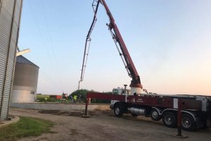 Concrete being properly placed by a concrete pump truck and boom provided by L&N Concrete Pumping